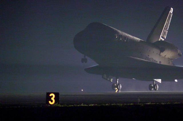 KENNEDY SPACE CENTER, Fla. -- Space Shuttle Discovery approaches touchdown on runway 15 at the KSC Shuttle Landing Facility. Main gear touchdown occurred at 2:31:42 a.m. EST, nose wheel touchdown at 2:31:54 a.m., and wheel stop at 2:33:06 a.m. The landing on orbit 201 concluded mission STS-102, the eighth flight to the International Space Station, carrying the first Multi-Purpose Logistics Module Leonardo, to the ISS and Expedition Two, a replacement crew for the Station. The 12-day, 19-hour, 51-minute mission returned both the Leonardo and the first resident crew of the ISS, Expedition One, to KSC . Discovery logged 5.3 million miles on this mission. The landing marked the 54th at KSC in the history of the program, and the 12th night landing at KSC