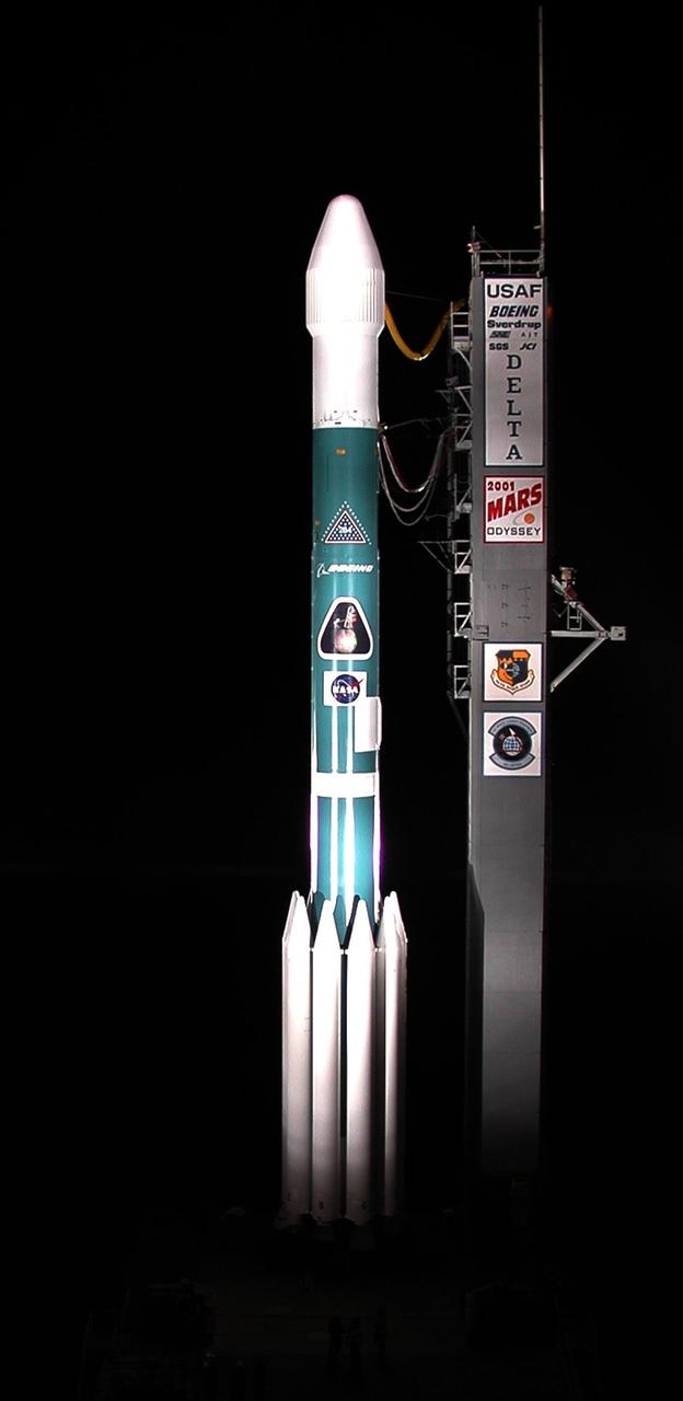 Spotlights capture the Boeing Delta II rocket waiting on Launch Complex 17, Cape Canaveral Air Force Station, to launch the 2001 Mars Odyssey spacecraft into space on its 7-month journey to Mars. Liftoff is scheduled for 11:02 a.m. EDT from Launch Complex 17-A at Cape Canaveral Air Force Station. The spacecraft, built by Lockheed Martin Space Systems for the Jet Propulsion Laboratory, will orbit Mars, mapping the surface looking for geological features that could indicate the presence of water, now or in the past. Science gathered by three science instruments on board will be key to future missions to Mars, including orbital reconnaissance, lander and human missions