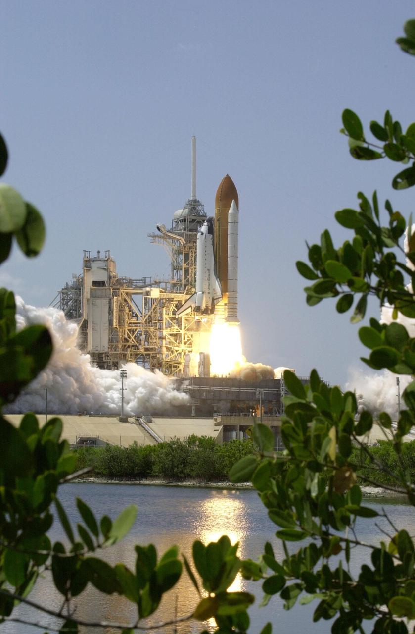 KENNEDY SPACE CENTER, FLA. -- Spring leaves frame the launch of Space Shuttle Endeavour on mission STS-100, the ninth flight to the International Space Station. Liftoff occurred at 2:40:42 p.m. EDT. The 11-day mission will deliver and integrate the Spacelab Logistics Pallet/Launch Deployment Assembly, which includes the Space Station Remote Manipulator System and the UHF Antenna. The mission includes two planned spacewalks for installation of the SSRMS on the Station. Also onboard is the Multi-Purpose Logistics Module Raffaello, carrying resupply stowage racks and resupply/return stowage platform