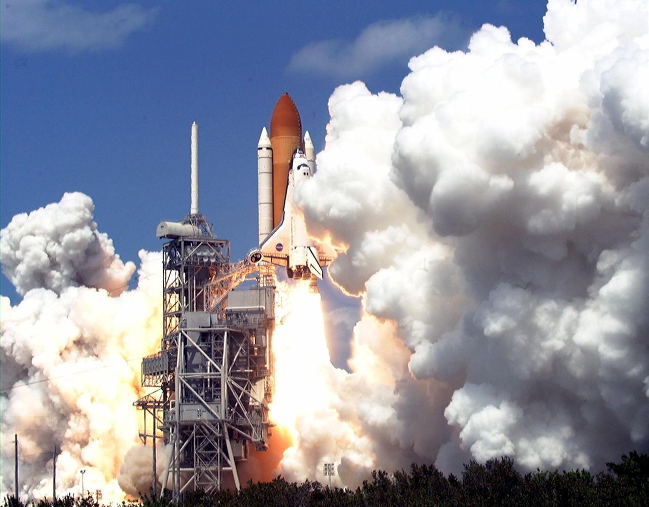 KENNEDY SPACE CENTER, FLA. -- Billows of steam almost obscure Space Shuttle Endeavour as it roars off Launch Pad 39A on mission STS-100. Liftoff of the ninth flight to the International Space Station occurred at 2:40:42 p.m. EDT. The 11-day mission will deliver and integrate the Spacelab Logistics Pallet/Launch Deployment Assembly, which includes the Space Station Remote Manipulator System and the UHF Antenna. The mission includes two planned spacewalks for installation of the SSRMS on the Station. Also onboard is the Multi-Purpose Logistics Module Raffaello, carrying resupply stowage racks and resupply/return stowage platforms