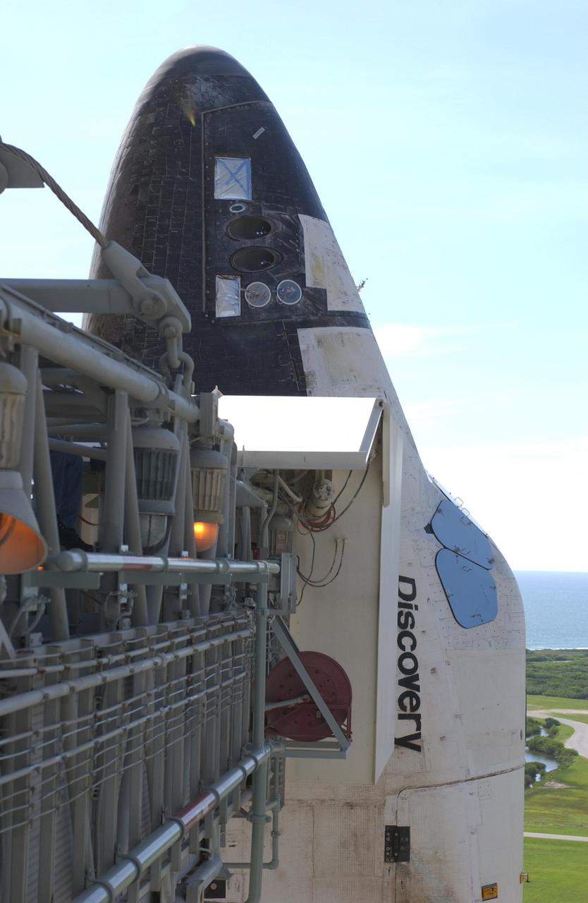 KENNEDY SPACE CENTER, Fla. -- - This closeup at about the 147-foot level shows the orbiter access arm as it extends toward the side of Discovery. At the end is the White Room, which provides entry into the orbiter. Discovery is scheduled to launch in early August on mission STS-105.     Photo by Scott Andrews using a Nikon D1X camera