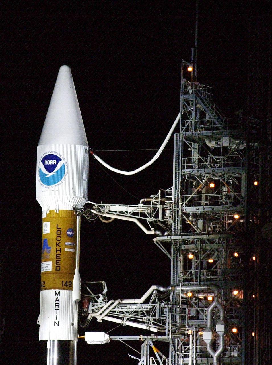 KENNEDY SPACE CENTER, Fla. -- The GOES-M satellite is poised for flight at Launch Complex 36-A, Cape Canaveral Air Force Station, after rollback of the Mobile Service Tower. GOES-M is the last in the current series of advanced geostationary weather satellites in service. GOES-M has a new instrument not on earlier spacecraft, a Solar X-ray Imager, which can be used in forecasting space weather and the effects of solar storms. The satellite is scheduled to launch atop an Atlas rocket on July 23 during a window that extends from 3:02 to 4:26 a.m. EDT