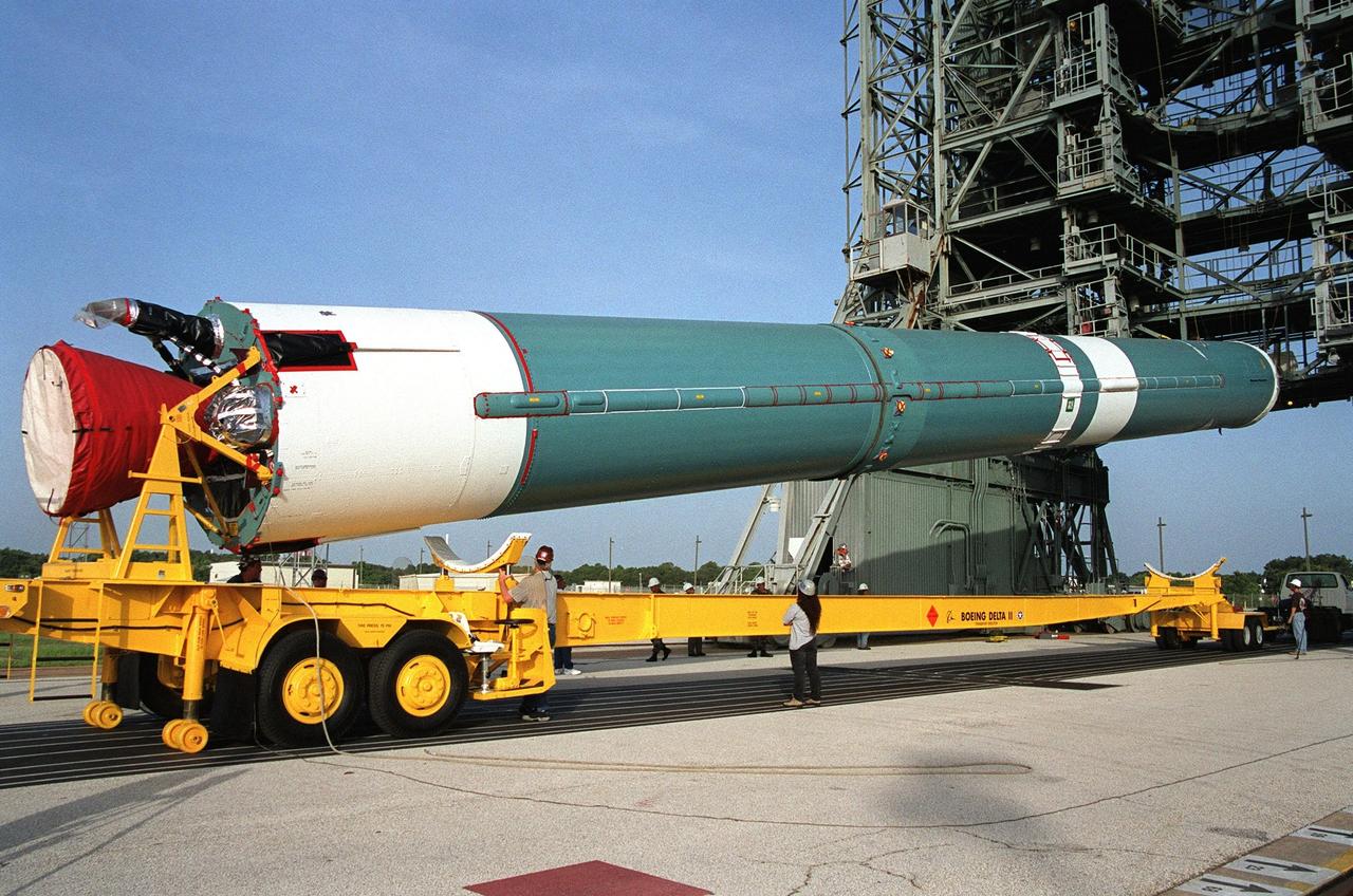 KENNEDY SPACE CENTER, Fla. -- The first stage of a Boeing Delta II rocket arrives on Launch Complex 17A, Cape Canaveral Air Force Station. The rocket will propel the Genesis spacecraft on a journey to capture samples of the ions and elements in the solar wind and return them to Earth for scientists to use to determine the exact composition of the Sun and the solar system’s origin. NASA's Genesis project in managed by the Jet Propulsion Laboratory in Pasadena, Calif. Lockheed Martin Astronautics built the Genesis spacecraft for NASA in Denver, Colo. The launch is scheduled for July 30 at 12:36 p.m. EDT