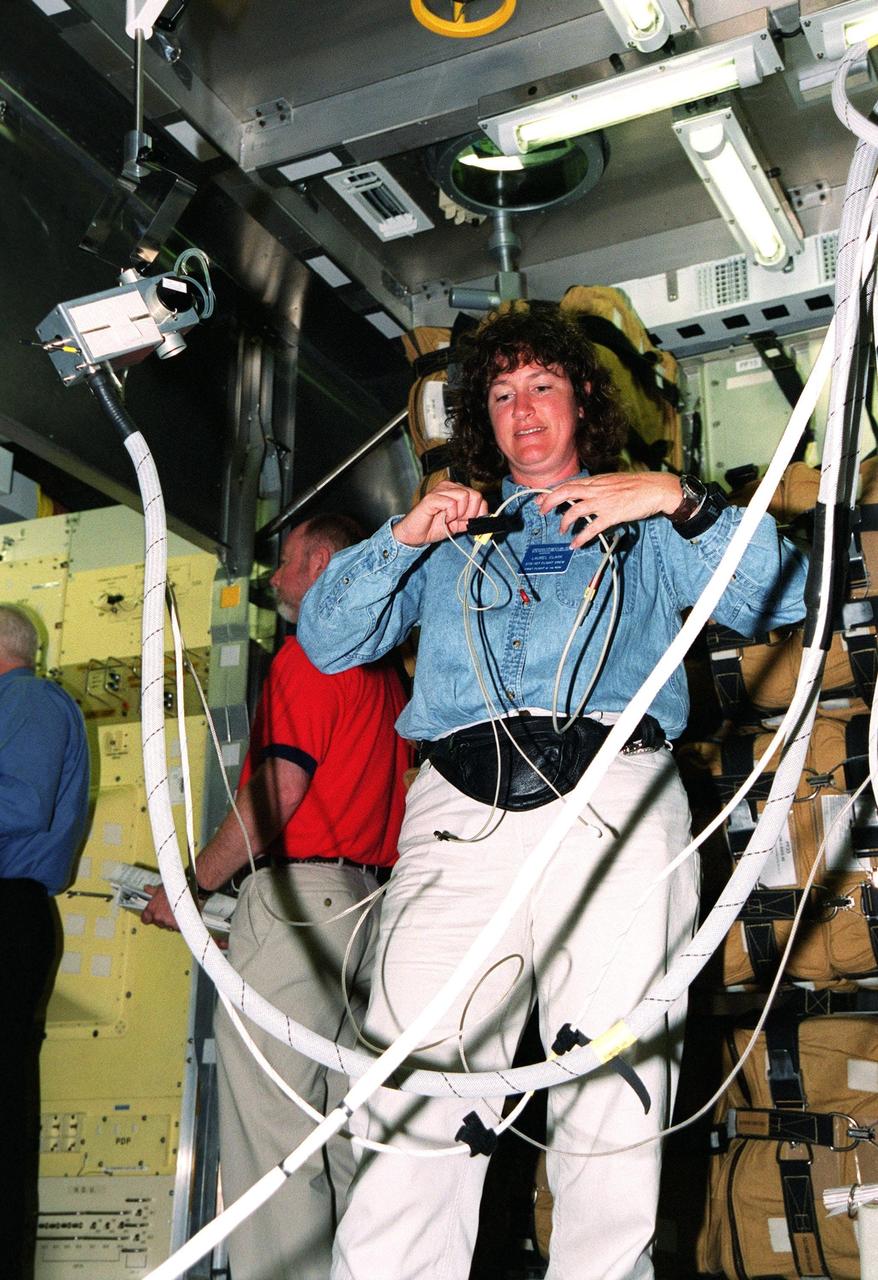 KENNEDY SPACE CENTER, Fla. -- During Crew Equipment Interface Test (CEIT)activities at SPACEHAB, Cape Canaveral, Fla., STS-107 Mission Specialist Laurel Blair Salton Clark gets hands-on training on equipment inside the Spacehab module. As a research mission, STS-107 will carry the Spacehab Double Module in its first research flight into space and a broad collection of experiments ranging from material science to life science. CEIT activities enable the crew to perform certain flight operations, operate experiments in a flight-like environment, evaluate stowage locations and obtain additional exposure to specific experiment operations. Other STS-107 crew members are Commander Rick Douglas Husband; Pilot William C. McCool; Payload Commander Michael P. Anderson; Mission Specialists Kalpana Chawla and David M. Brown; and Payload Specialist Ilan Ramon, of Israel. STS-107 is scheduled for launch May 23, 2002