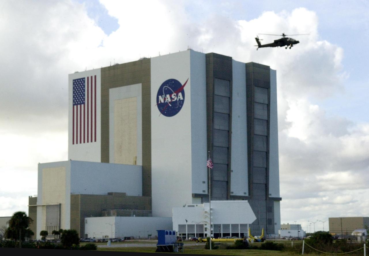 KENNEDY SPACE CENTER, FLA. -- A United States military Apache H64A helicopter patrols Kennedy Space Center airspace near the Vehicle Assembly Building as the launch of Space Shuttle Endeavour on mission STS-108 to the International Space Station approaches.  Launch is scheduled for 7:41 p.m. EST on Nov. 29