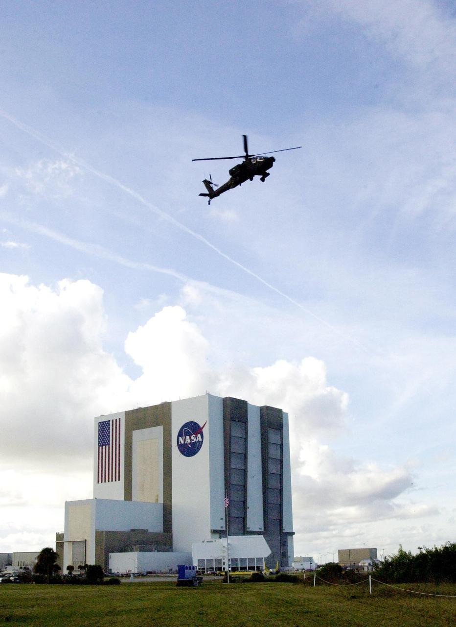 KENNEDY SPACE CENTER, FLA. -- A United States military Apache H64A helicopter patrols Kennedy Space Center airspace near the Vehicle Assembly Building as the launch of Space Shuttle Endeavour on mission STS-108 to the International Space Station approaches.  Launch is scheduled for 7:41 p.m. EST on Nov. 29