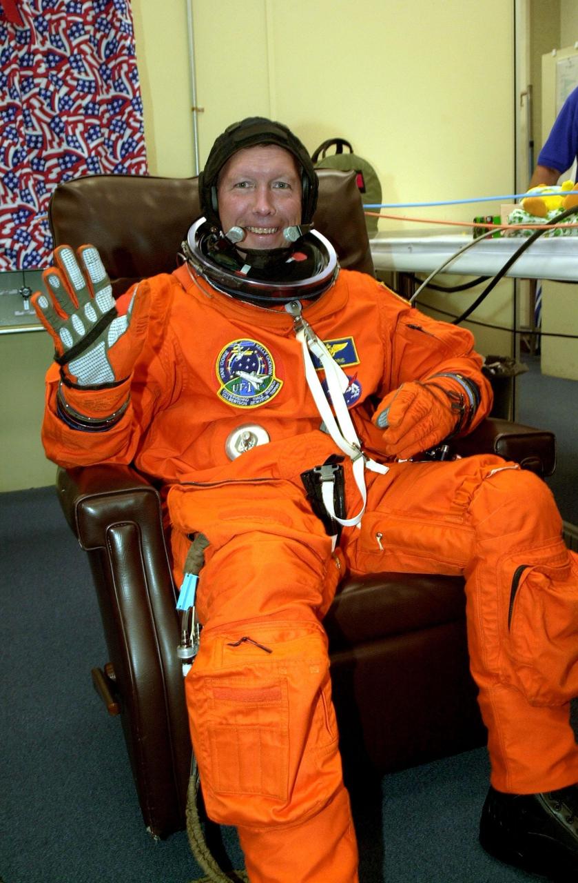 KENNEDY SPACE CENTER, Fla. --  STS-108 Commander Dominic L. Gorie gets a final suit check prior to heading to Launch Pad 39B and Space Shuttle Endeavour. Top priorities for the 11-day STS-108 (UF-1) mission of Endeavour are rotation of the International Space Station Expedition 3 and Expedition 4 crews; bringing water, equipment and supplies to the station in the Multi-Purpose Logistics Module Raffaello; and the crew's completion of robotics tasks and a spacewalk to install thermal blankets over two pieces of equipment at the bases of the Space Station's solar wings.   Launch is scheduled for 5:45 p.m. EST Dec. 4, 2001, from Launch Pad 39B