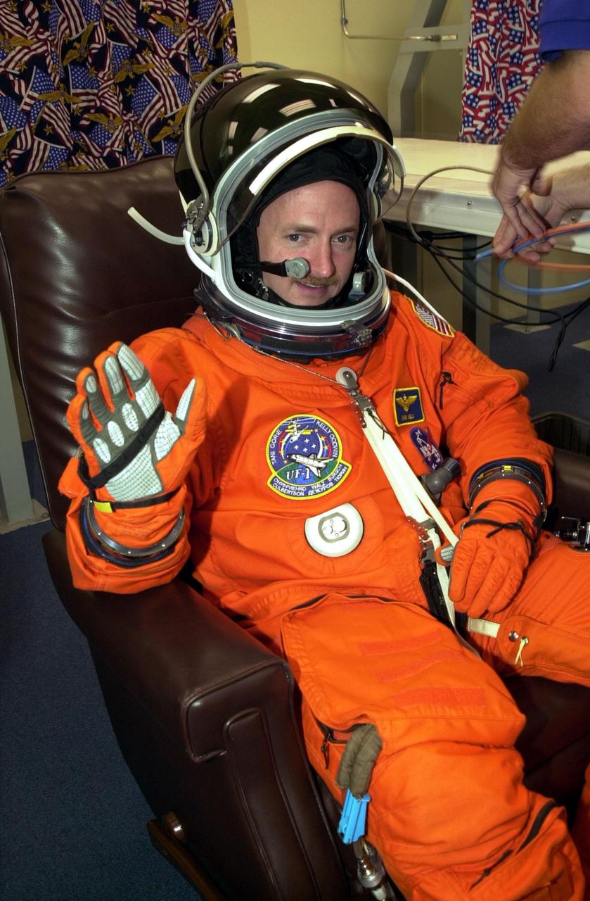 KENNEDY SPACE CENTER, Fla. -- STS-108 Pilot Mark E. Kelly gets a final suit check prior to heading to Launch Pad 39B and Space Shuttle Endeavour. Top priorities for the 11-day STS-108 (UF-1) mission of Endeavour are rotation of the International Space Station Expedition 3 and Expedition 4 crews; bringing water, equipment and supplies to the station in the Multi-Purpose Logistics Module Raffaello; and the crew's completion of robotics tasks and a spacewalk to install thermal blankets over two pieces of equipment at the bases of the Space Station's solar wings. Launch is scheduled for 5:45 p.m. EST Dec. 4, 2001, from Launch Pad 39B