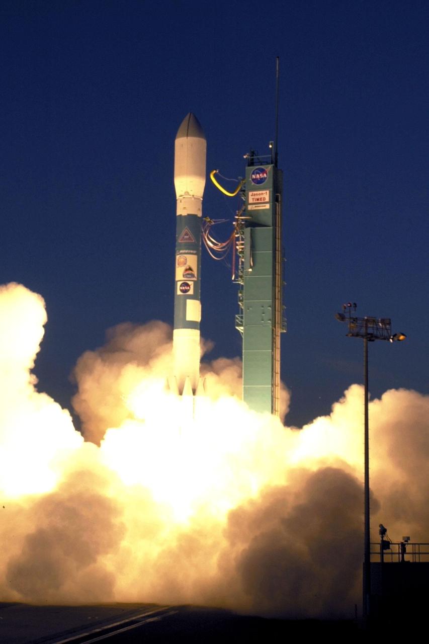 VANDENBERG AIR FORCE BASE, Calif.. -- A Delta rocket leaps off Launch Complex 2W carrying the joint NASA/French Space Agency oceanography satellite Jason 1 and Thermosphere Ionosphere Mesosphere Energetics and Dynamics satellite aboard. Liftoff occurred at 7:07 a.m. PST (10:07 a.m. EST or 15:07 GMT). Jason 1 joins the orbiting Topex/Poseidon satellite to continue observations of the global climate interaction occurring between the sea and the atmosphere as a result of stored solar energy. Instruments on Jason 1 will map variations in ocean surface topography to monitor world ocean circulation, study interactions of the oceans and atmosphere, improve climate predictions and observe events like El Nino. The mission is expected to last three years. The TIMED satellite will study a little-known region above the atmosphere, some 40 to 110 miles from the Earth's surface. Studying this region has been nearly impossible until now because conventional airplanes and balloons cannot reach this high altitude, and it is too low for direct satellite measurements