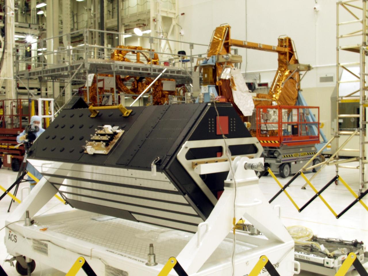KENNEDY SPACE CENTER, FLA. -- The Advanced Camera for Surveys (ACS), foreground, is part of the STS-109 flight hardware for maintenance of the Hubble Space Telescope (HST). The ACS and other hardware, installed on four principle payload carriers, are being processed inside the clean room at the Vertical Processing Facility (VPF). The STS-109 launch aboard Columbia is targeted for Feb. 14, 2002, and will be the 108th flight in the Space Shuttle program