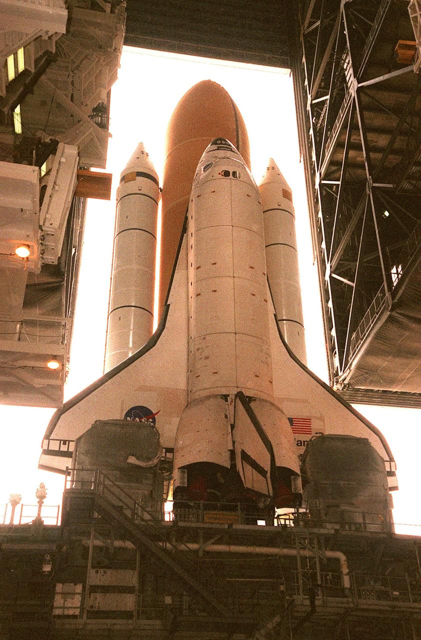 KENNEDY SPACE CENTER, FLA. -- Viewed from inside the Vehicle Assembly Building, Space Shuttle Atlantis moves back inside after an aborted rollout to Launch Pad 39A. Atlantis will fly on mission STS-98, the seventh construction flight to the International Space Station. The orbiter will carry in its payload bay the U.S. Laboratory, named Destiny, that will have five system racks already installed inside the module. After delivery of electronics in the lab, electrically powered attitude control for Control Moment Gyroscopes will be activated. Atlantis is scheduled for launch no earlier than Jan. 19, 2001, with a crew of five