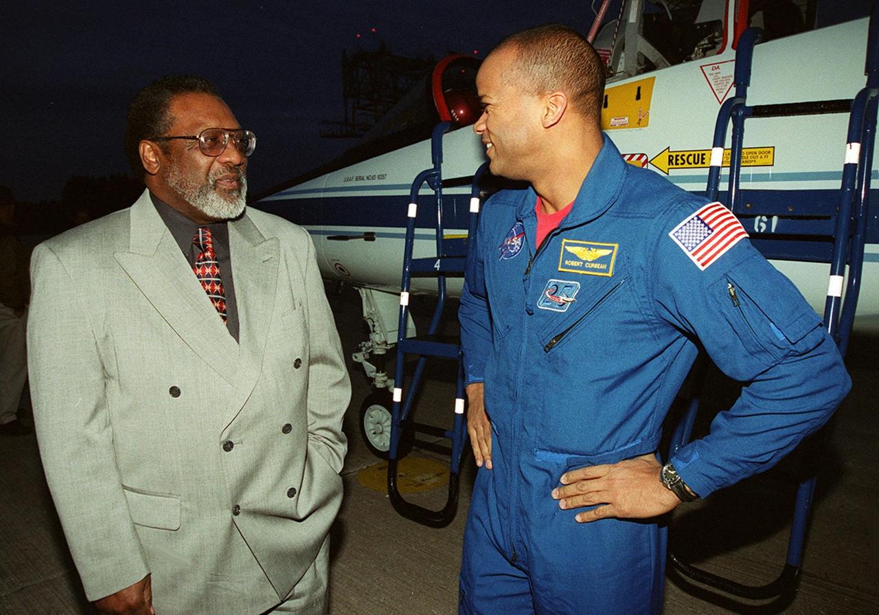 KSC’s Deputy Director James Jennings (left) welcomes STS-98 Mission Specialist Robert Curbeam to KSC. The STS-98 crew Commander Ken Cockrell, Pilot Mark Polansky and Mission Specialists Curbeam, Thomas Jones and Marsha Ivins arrived to take part in Terminal Countdown Test Demonstration activities in preparation for launch. They will be training in emergency procedures from the pad, checking the payload and taking part in a simulated countdown. The payload for the mission is the U.S. Lab Destiny, a key element in the construction of the International Space Station. The lab has five system racks already installed inside the module. After delivery of electronics in the lab, electrically powered attitude control for Control Moment Gyroscopes will be activated. STS-98 is the seventh construction flight to the ISS
