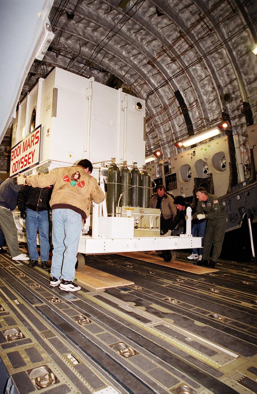 The Mars Odyssey spacecraft is maneuvered for removal from the Air Force C-17 cargo airplane that brought it from Denver, Colo.., location of the Lockheed Martin plant where the spacecraft was built. Mars Odyssey will be moved on a transport trailer from KSC's Shuttle Landing Facility to the Spacecraft Assembly and Encapsulation Facility 2 (SAEF-2) located in the KSC Industrial Area. In the SAEF it will undergo final assembly and checkout. This includes installation of two of the three science instruments, integration of the three-panel solar array, and a spacecraft functional test. It will be fueled and then mated to an upper stage booster, the final activities before going to the launch pad. Launch is planned for April 7, 2001 the first day of a 21-day planetary window. Mars Odyssey will be inserted into an interplanetary trajectory by a Boeing Delta II launch vehicle from Pad A at Complex 17 at the Cape Canaveral Air Force Station, Fla. The spacecraft will arrive at Mars on Oct. 20, 2001, for insertion into an initial elliptical capture orbit. Its final operational altitude will be a 250-mile-high, Sun-synchronous polar orbit. Mars Odyssey will spend two years mapping the planet's surface and measuring its environment