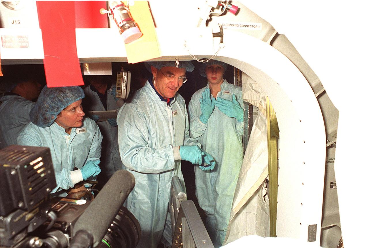 KENNEDY SPACE CENTER, FLA. -- Looking at the inside of the Multi-Purpose Logistics Module Leonardo are (left to right) Expedition Two astronauts Susan J. Helms and James S. Voss. They will be flying on STS-102 to the International Space Station, replacing the Expedition One crew, who will return to Earth on the Shuttle. Leonardo is part of the payload on STS-102 and will carry laboratory racks filled with equipment, experiments and supplies to and from the Space Station aboard the Space Shuttle. STS-102 is scheduled to be launched in early March 2001
