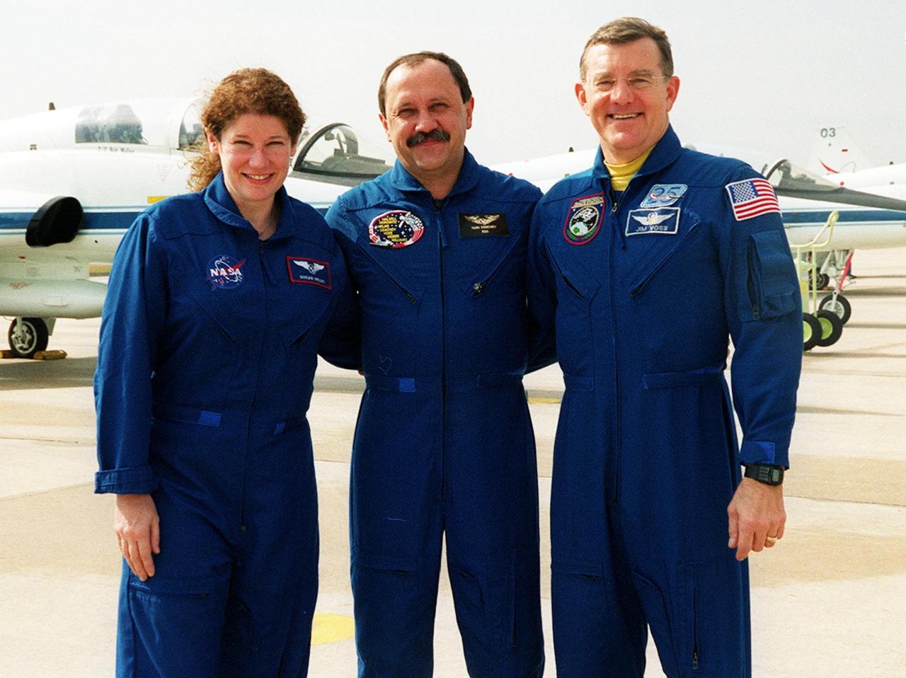 The three members of the Expedition Two crew arrive at KSC. Standing, left to right, are astronaut Susan Helms, cosmonaut Yury Usachev, and astronaut James Voss. They will be flying on mission STS-102 to the International Space Station, replacing the Expedition One crew, who will return to earth on Discovery. STS-102 will be Helms’ and Voss’s fifth Shuttle flight, and Usachev’s second