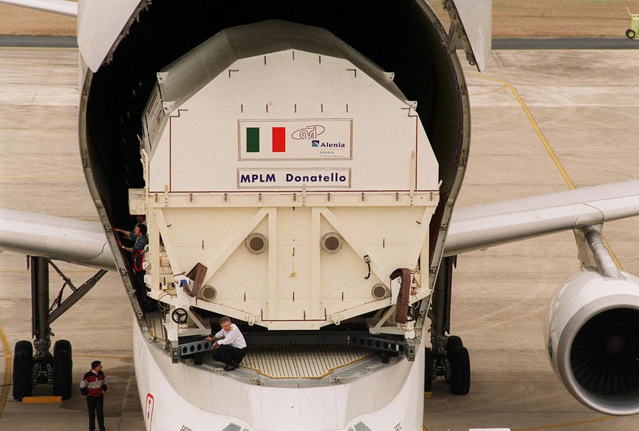 At the KSC <a href="../../subjects/slf.htm"> Shuttle Landing Facility</a>, the Italian Space Agency’s <a href="../../subjects/mplm.htm"> Multi-Purpose Logistics Module Donatello</a> begins rolling out of the Airbus “Beluga” air cargo plane that brought it from the factory of Alenia Aerospazio in Turin, Italy. The third of three for the International Space Station, the module will be transported to the <a href="../../subjects/sspf.htm"> Space Station Processing Facility</a> for processing. Among the activities for the payload test team are integrated electrical tests with other Station elements in the SSPF, leak tests, electrical and software compatibility tests with the Space Shuttle (using the Cargo Integrated Test equipment) and an Interface Verification Test once the module is installed in the Space Shuttle’s payload bay at the launch pad. The most significant mechanical task to be performed on Donatello in the SSPF is the installation and outfitting of the racks for carrying the various experiments and cargo