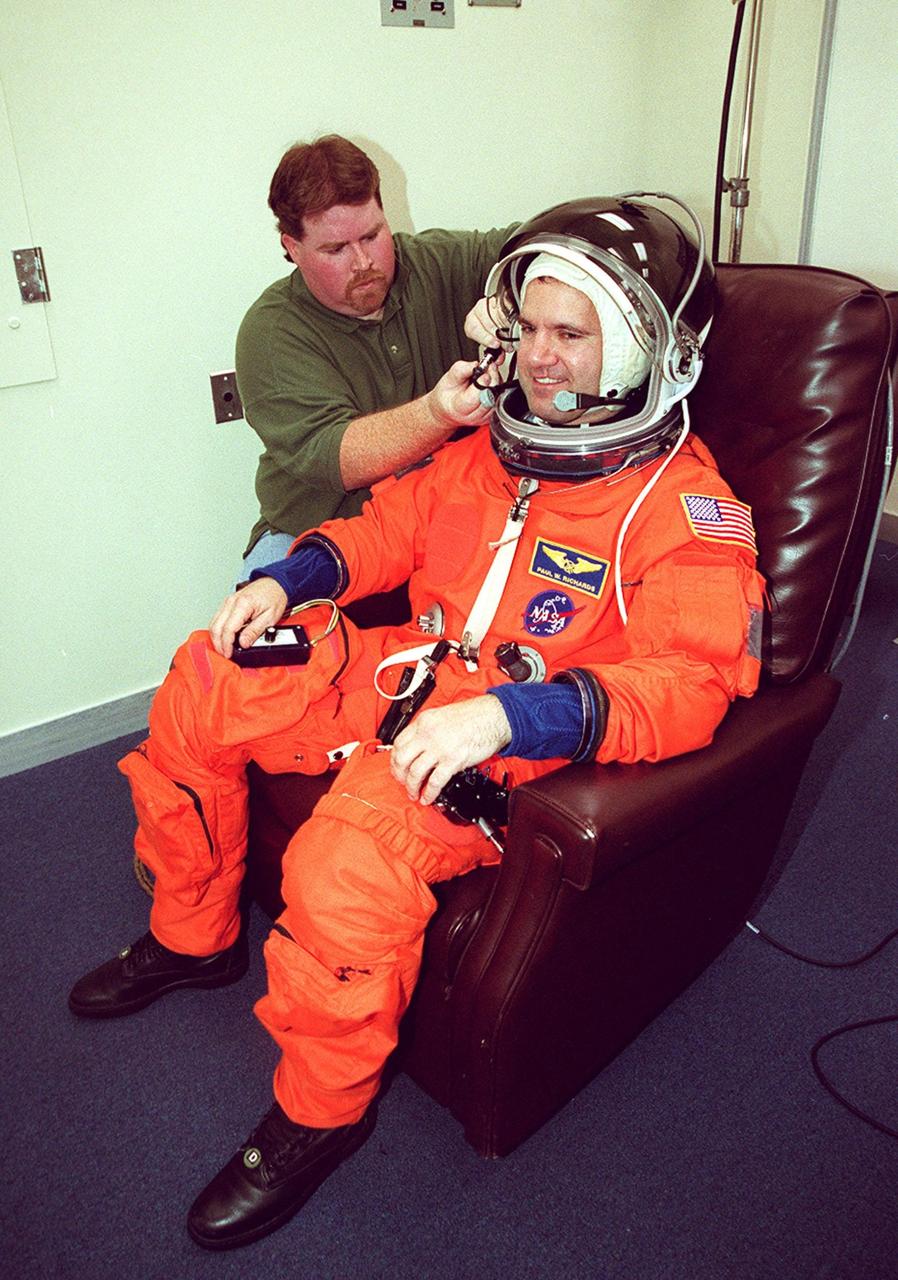 STS-102 Mission Specialist Paul Richards has his launch suit checked for fit in the Operations and Checkout Building. The crew is at KSC to take part in Terminal Countdown Demonstration Test activities, which include emergency exit from the launch pad and a simulated launch countdown. STS-102 is the eighth construction flight to the International Space Station, carrying as payload the Multi-Purpose Logistics Module Leonardo. In addition, the Expedition Two crew will be on board, heading to the Space station for a four-month tenure. The Expedition One crew will return to Earth aboard Discovery. Launch on mission STS-102 is scheduled for March 8