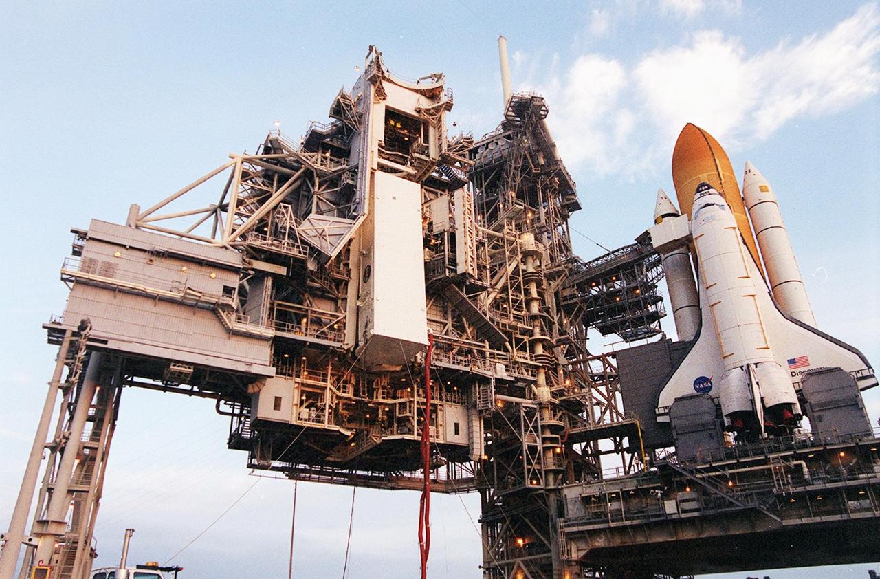 KENNEDY SPACE CENTER, FLA. --  At Launch Pad 39B the payload canister, with the Multi-Purpose Logistics Module Leonardo inside, is lifted to the payload changeout room on the Rotating Service Structure. Umbilical hoses, maintaining a controlled environment for the cargo, are still attached to the lower end of the canister. At the PCR, the payload ground-handling mechanism (PGHM) will be used to transfer Leonardo out of the canister and then into Space Shuttle Discovery’s payload bay. One of Italy’s major contributions to the International Space Station program, Leonardo is a reusable logistics carrier. It is the primary delivery system used to resupply and return Station cargo requiring a pressurized environment. Leonardo is the primary payload on mission STS-102 and will deliver up to 10 tons of laboratory racks filled with equipment, experiments and supplies for outfitting the newly installed U.S. Laboratory Destiny. STS-102 is scheduled to launch March 8 at 6:45 a.m. EST