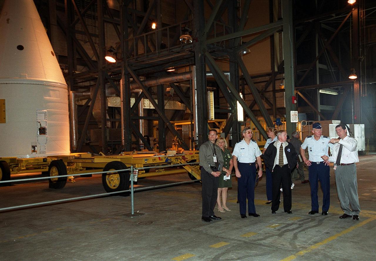 Dave King (far right), director of Shuttle Processing , explains part of the launch process to (from left) Dave Rainer; Brig. Gen. Donald Pettit, Commander of the 45th Space Wing, Cape Canaveral; Roy Bridges, KSC’s Center Director; and Gen. Ralph Everhart, Commander, Space Command , who are touring the Vehicle Assembly Building