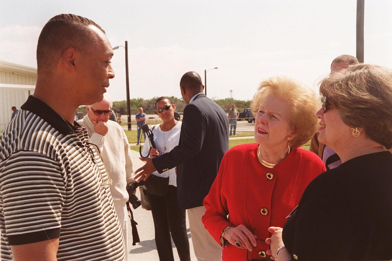 Taking a tour of KSC is Lady Margaret Thatcher (second from right), former Prime Minister of Britain. Next to her (far right) is JoAnn H. Morgan, director, External Relations and Business Development at KSC. They are outside the Orbiter Processing Facility bay 2, which contains Endeavour, next flying on mission STS-100, the ninth construction flight to the International Space Station