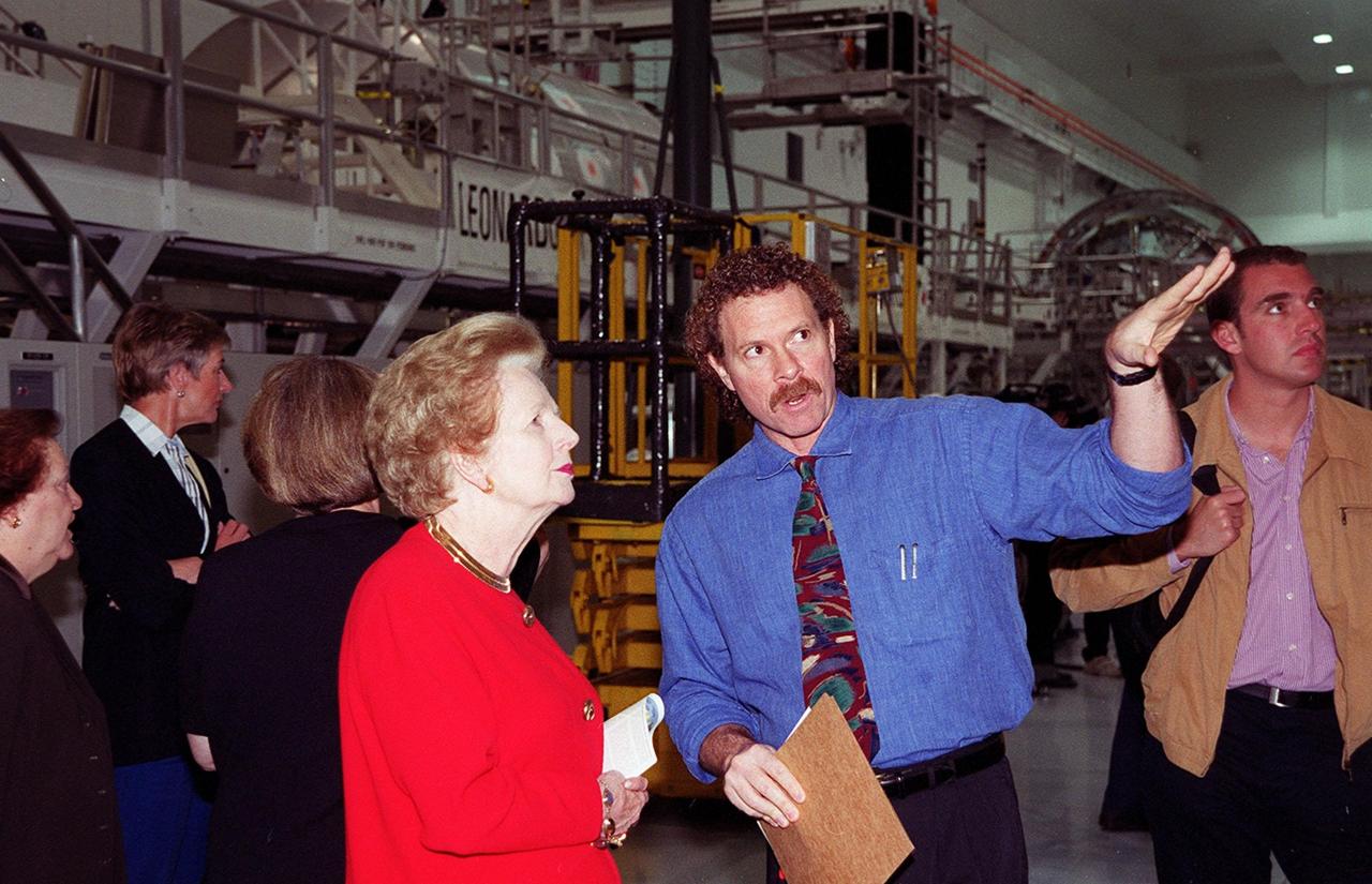 Lady Margaret Thatcher, former Prime Minister of Great Britain, learns about some of the modules in the Space Station Processing Facility. Lady Thatcher is on a tour of KSC