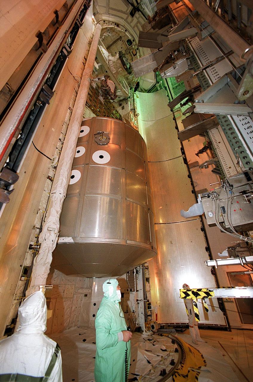 KENNEDY SPACE CENTER, FLA. -- The Multi-Purpose Logistics Module Leonardo is moved into Space Shuttle Discovery’s payload bay. The primary delivery system used to resupply and return Station cargo requiring a pressurized environment, Leonardo will deliver up to 10 tons of laboratory racks filled with equipment, experiments and supplies for outfitting the newly installed U.S. Laboratory Destiny. Discovery is scheduled to launch March 8 at 6:42 a.m. EST on mission STS-102, the eighth construction flight to the International Space Station