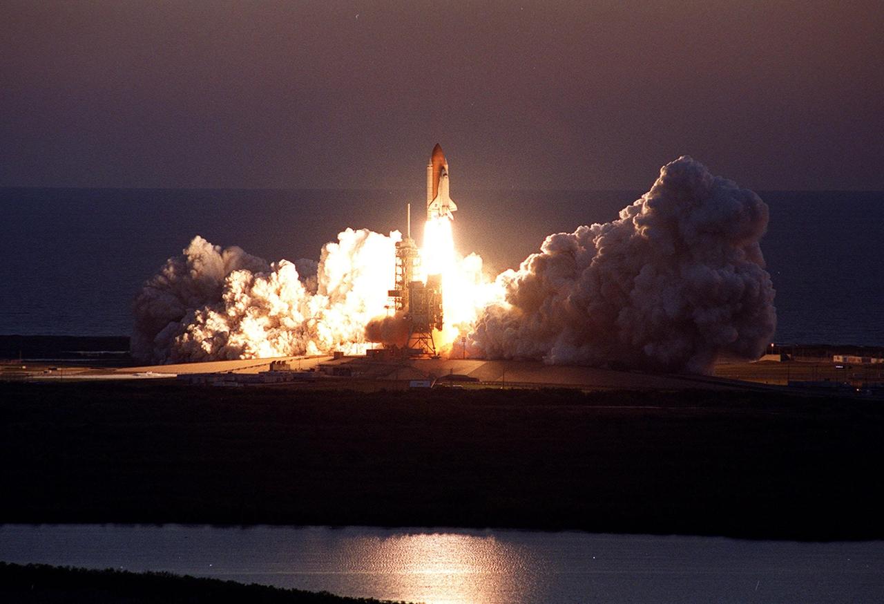 KENNEDY SPACE CENTER, Fla. -- Viewed from the top of the Vehicle Assembly Building, Space Shuttle Discovery leaps from the Earth against the background of the Atlantic Ocean on mission STS-102. Liftoff at dawn occurrred at 6:42:09 EST for the eighth flight to the International Space Station
