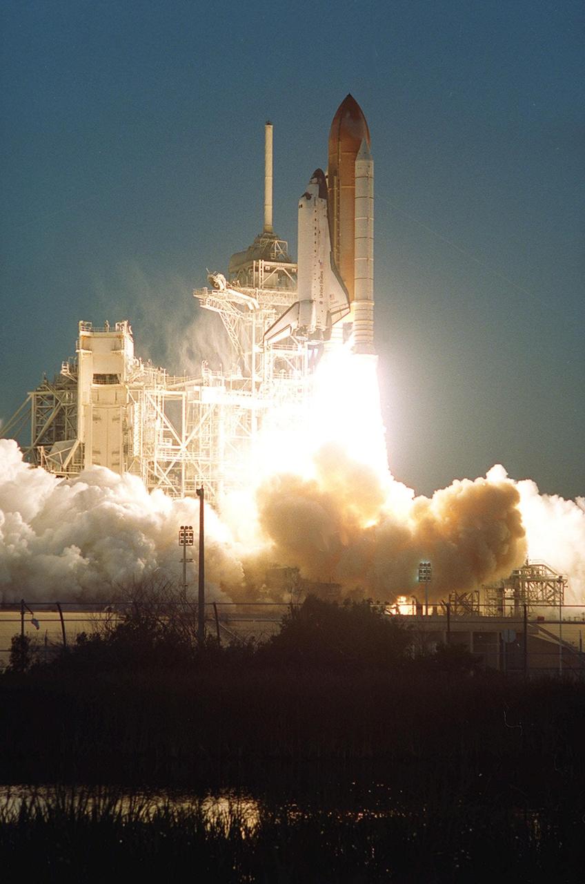 KENNEDY SPACE CENTER, Fla. -- Clouds of smoke and steam flow from Space Shuttle Discovery as it lifts off on mission STS-102 to the International Space Station. The brilliance of the launch rivaled the sunrise on this perfect launch. Liftoff occurred at 6:42:09 EST for the eighth flight to the Space Station