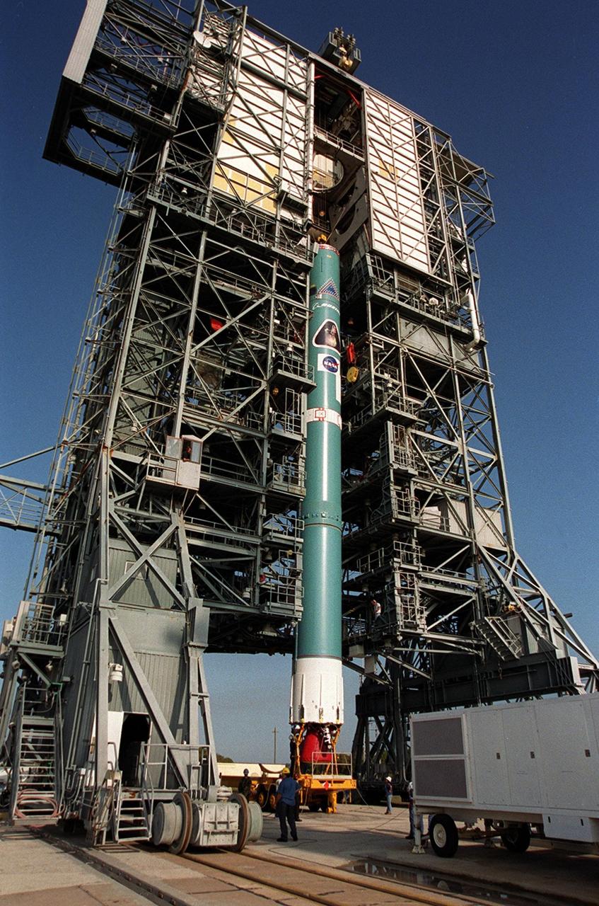 The first stage of a Boeing Delta rocket is in vertical position in the gantry on Launch Pad 17-A, Cape Canaveral Air Force Station. The rocket will carry the 2001 Mars Odyssey Orbiter, scheduled for launch April 7, 2001. Mars Odyssey contains three science instruments: THEMIS, the Gamma Ray Spectrometer (GRS), and the Mars Radiation Environment Experiment (MARIE). THEMIS will map the mineralogy and morphology of the Martian surface using a high-resolution camera and a thermal infrared imaging spectrometer. The GRS will achieve global mapping of the elemental composition of the surface and determine the abundance of hydrogen in the shallow subsurface. The MARIE will characterize aspects of the near-space radiation environment with regards to the radiation-related risk to human explorers