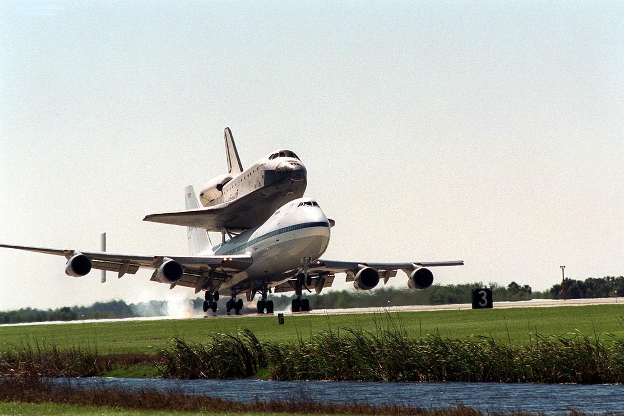The orbiter Atlantis arrives at KSC’s Shuttle Landing Facility riding piggyback on a Shuttle Carrier Aircraft, a modified Boeing 747. Atlantis landed in California Feb. 19 concluding mission STS-98. The ferry flight began in California March 1; unfavorable weather conditions kept it on the ground at Altus AFB, Okla., until it could return to Florida. The orbiter will next fly on mission STS-104, the 10th construction flight to the International Space Station, scheduled June 8