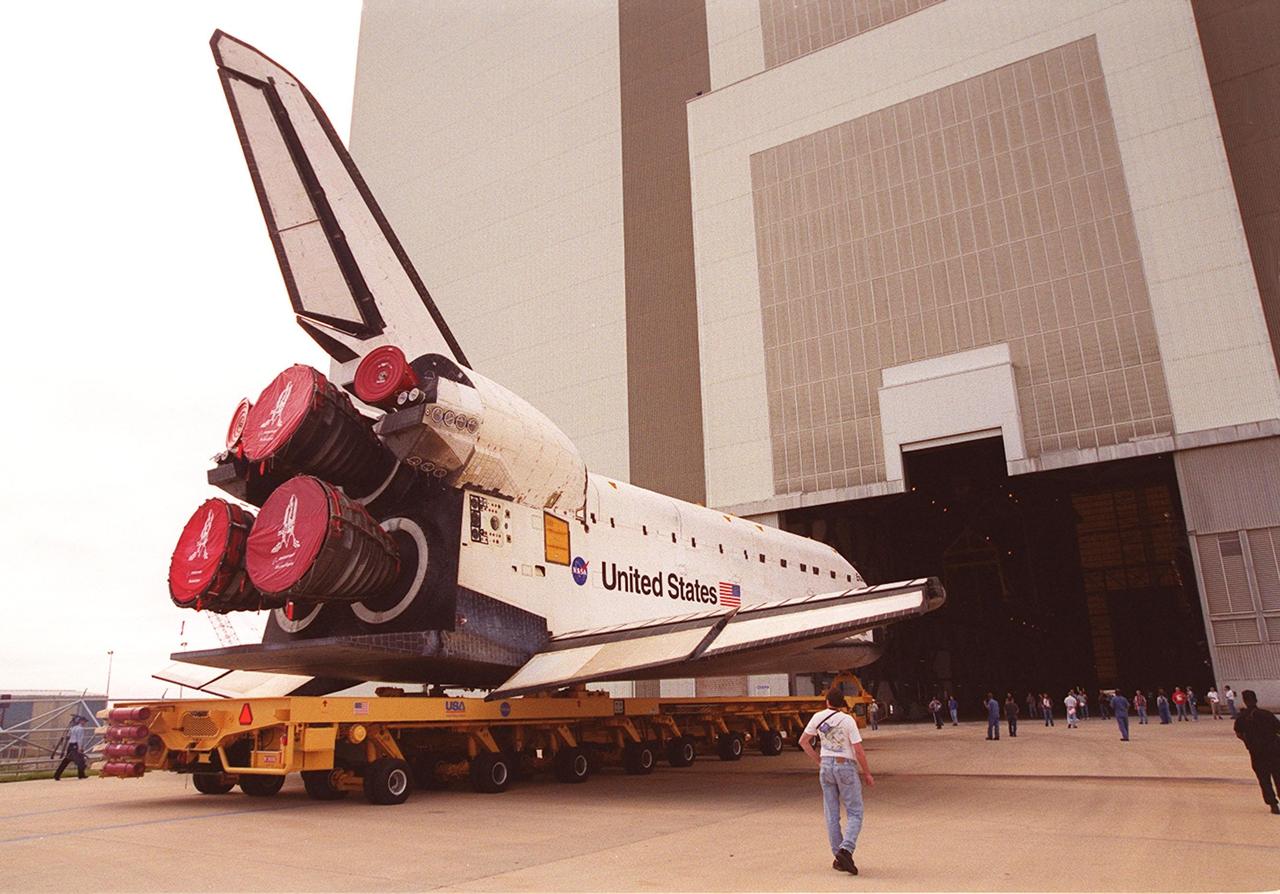 KENNEDY SPACE CENTER, FLA. -- Endeavour rolls toward the open doors of the Vehicle Assembly Building after leaving Orbiter Processing Facility bay 2. In the VAB, Endeavour will be stacked with its solid rocket boosters and external tank atop the Mobile Launcher Platform in high bay 3. Endeavour is scheduled to launch April 19 on mission STS-100, the ninth flight to the International Space Station