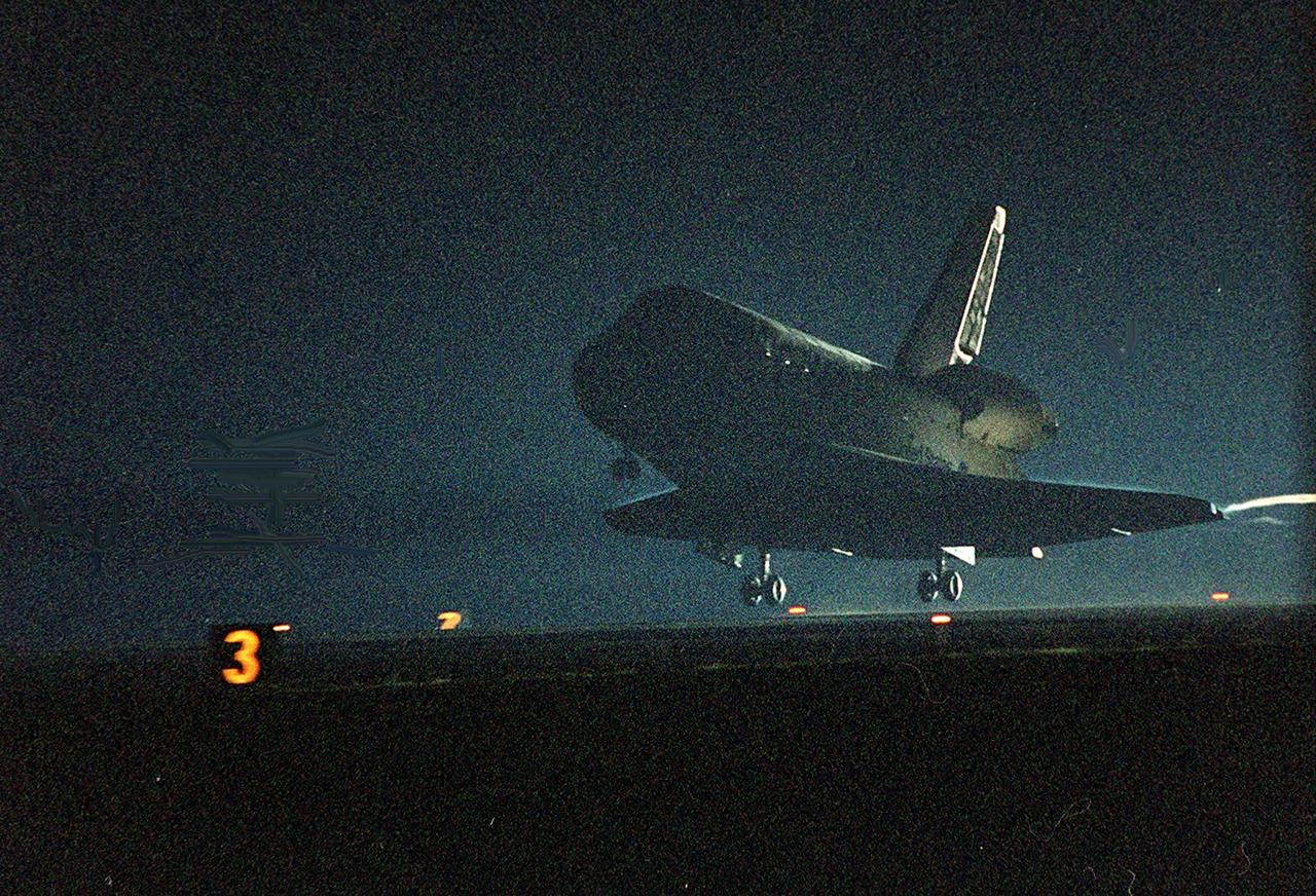 KENNEDY SPACE CENTER, Fla. --  Space Shuttle Discovery approaches touchdown on runway 15 at the KSC Shuttle Landing Facility. Main gear touchdown occurred about 2:31:42 a.m. EST, nose wheel touchdown at 2:31:54 a.m., and wheel stop at 2:33:06 a.m. The landing, on orbit 201, concluded mission STS-102, the eighth flight to the International Space Station, carrying the first Multi-Purpose Logistics Module Leonardo, to the ISS and Expedition Two, a replacement crew for the Station. The 12-day, 19-hour, 51-minute mission returned both the Leonardo and the first resident crew of the ISS, Expedition One, to KSC. Discovery logged 5.3 million miles on this mission. The landing marked the 54th at KSC in the history of the program, and the 12th night landing at KSC