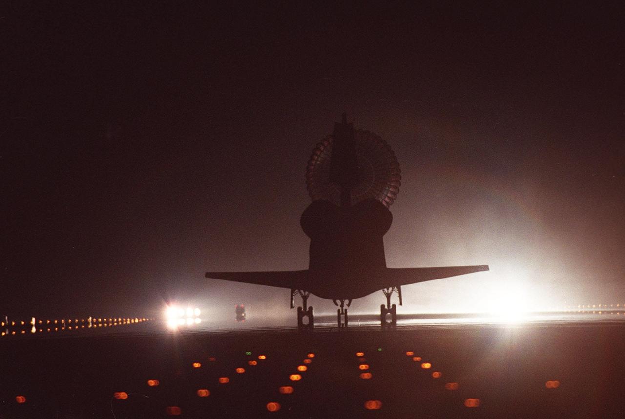 KENNEDY SPACE CENTER, Fla. -- Space Shuttle Discovery is silhouetted by the brilliant runway lights of runway 15 as it lands at the KSC Shuttle Landing Facility. Main gear touchdown occurred at 2:31:42 a.m. EST. Nose wheel touchdown occurred at 2:31:54 a.m., and wheel stop at 2:33:06 a.m. The landing on orbit 201 concluded mission STS-102, the eighth flight to the International Space Station, carrying the first Multi-Purpose Logistics Module, Leonardo, to the ISS and Expedition Two, a replacement crew for the Station. The 12-day, 19-hour, 51-minute mission returned both the Leonardo and the first resident crew of the ISS, Expedition One, to KSC. Discovery logged 5.3 million miles on this mission. The landing marked the 54th at KSC in the history of the program, and the 12th night landing at KSC