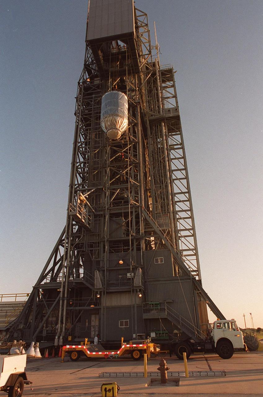 The Mars Odyssey spacecraft nears its destination on the gantry at Launch Pad 17-A, Cape Canaveral Air Force Station, where it will be mated with the Delta II rocket. The spacecraft will map the Martian surface in search of geological features that could indicate the presence of water, now or in the past, and may contribute significantly toward understanding what will be necessary for a more sophisticated exploration of Mars. Launch is scheduled for 11:02 a.m. EDT April 7