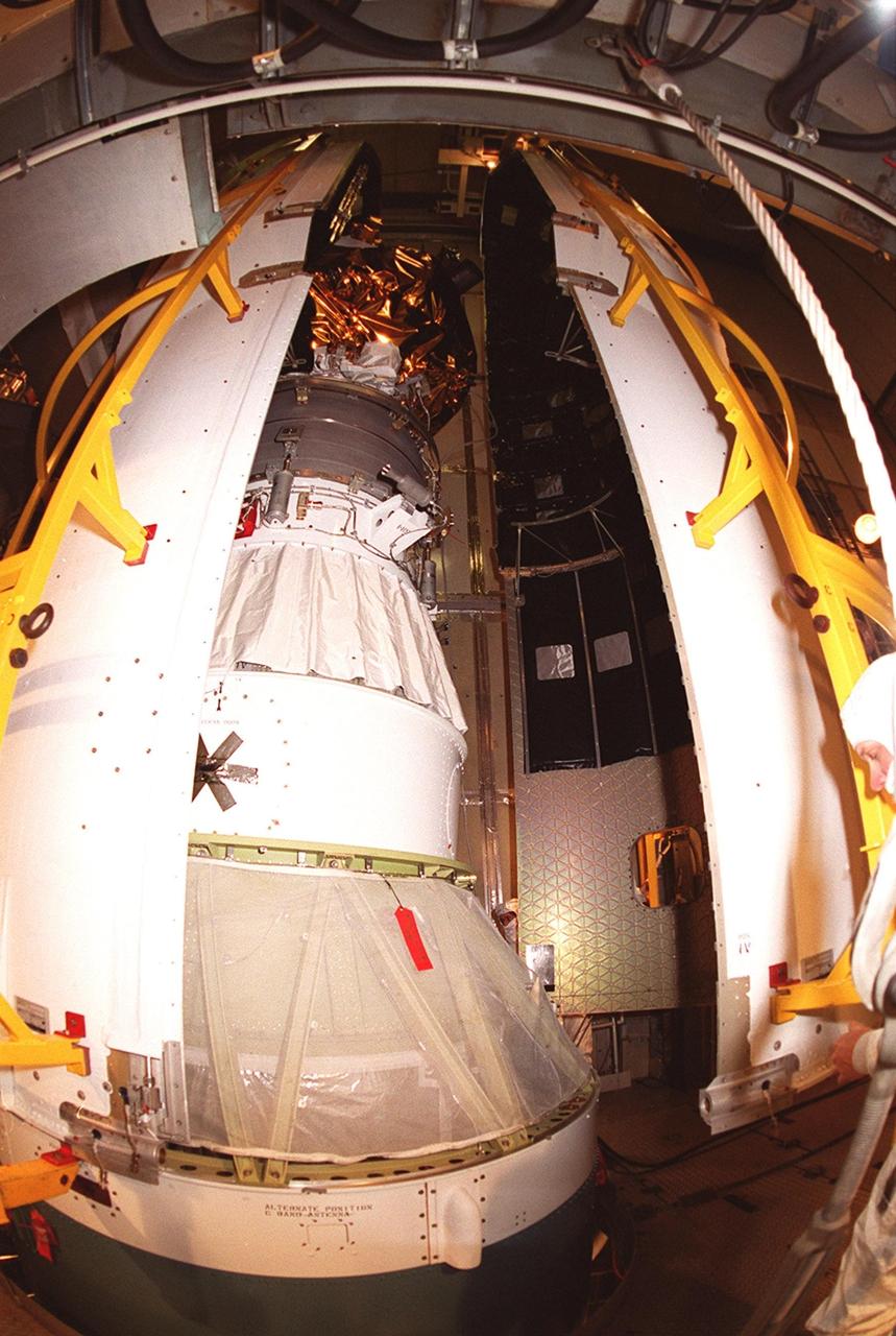 At Launch Complex 17-A, Cape Canaveral Air Force Station, the two parts of the Delta rocket fairing enclose the Mars Odyssey spacecraft. NASA’s latest explorer carries three scientific instruments to map the chemical and mineralogical makeup of Mars: a thermal-emission imaging system, a gamma ray spectrometer and a Martian radiation environment experiment. The imaging system will map the planet with high-resolution thermal images and give scientists an increased level of detail to help them understand how the mineralogy of the planet relates to the land forms. In addition, Odyssey will serve as a communications relay for U.S. and international landers arriving at Mars in 2003/2004. The Mars Odyssey is scheduled for launch aboard a Delta II rocket April 7, 2001, at 11:02 a.m. EST