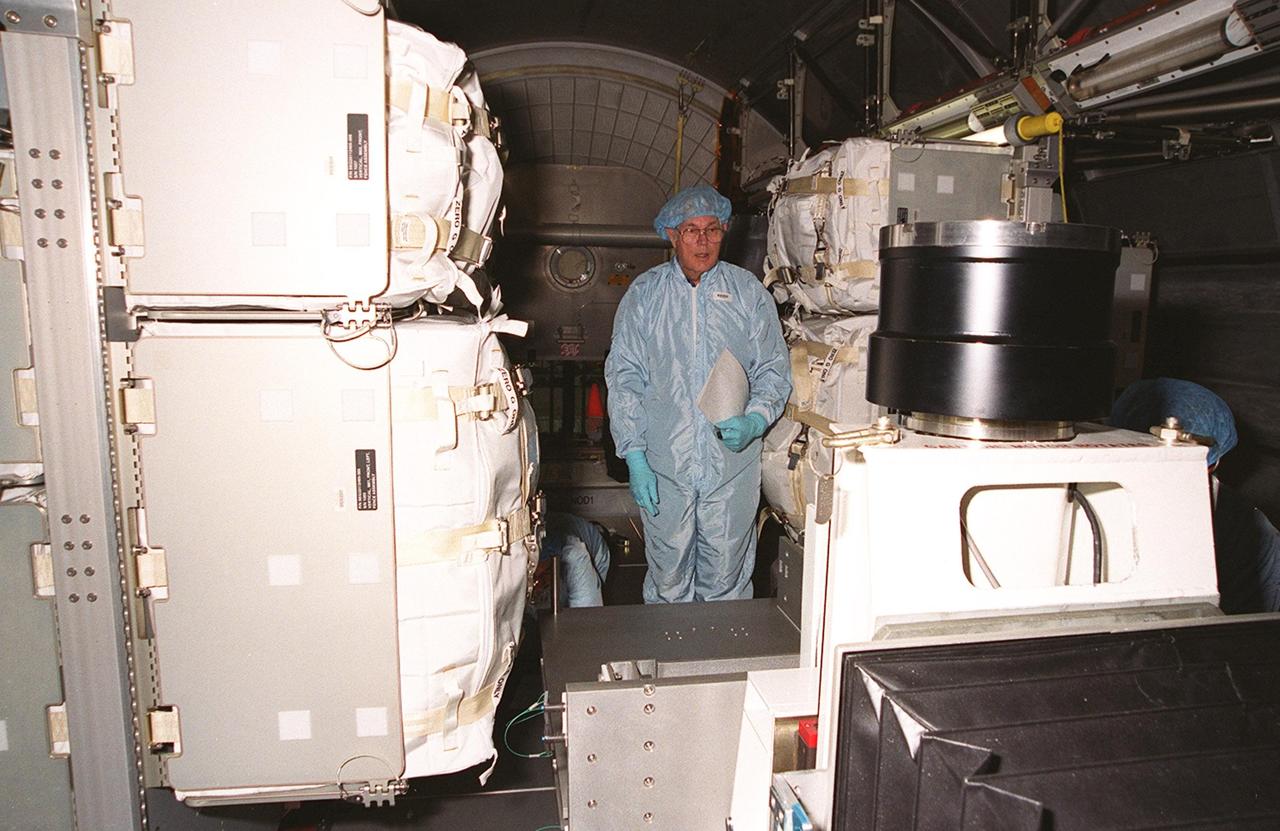 KENNEDY SPACE CENTER, FLA. -- Workers take inventory of the contents of the Multi-Purpose Logistics Module Leonardo, which is in the Space Station Processing Facility. The MPLM has just returned from its maiden voyage to the International Space Station aboard Discovery on mission STS-102. It has brought back to KSC nearly a ton of trash and excess equipment from the Space Station. Leonardo is one of three MPLMs built by the Italian Space Agency to serve as “cargo vans” to the Station, carrying supplies and equipment. In the SSPF, Leonardo will be prepared for a future mission