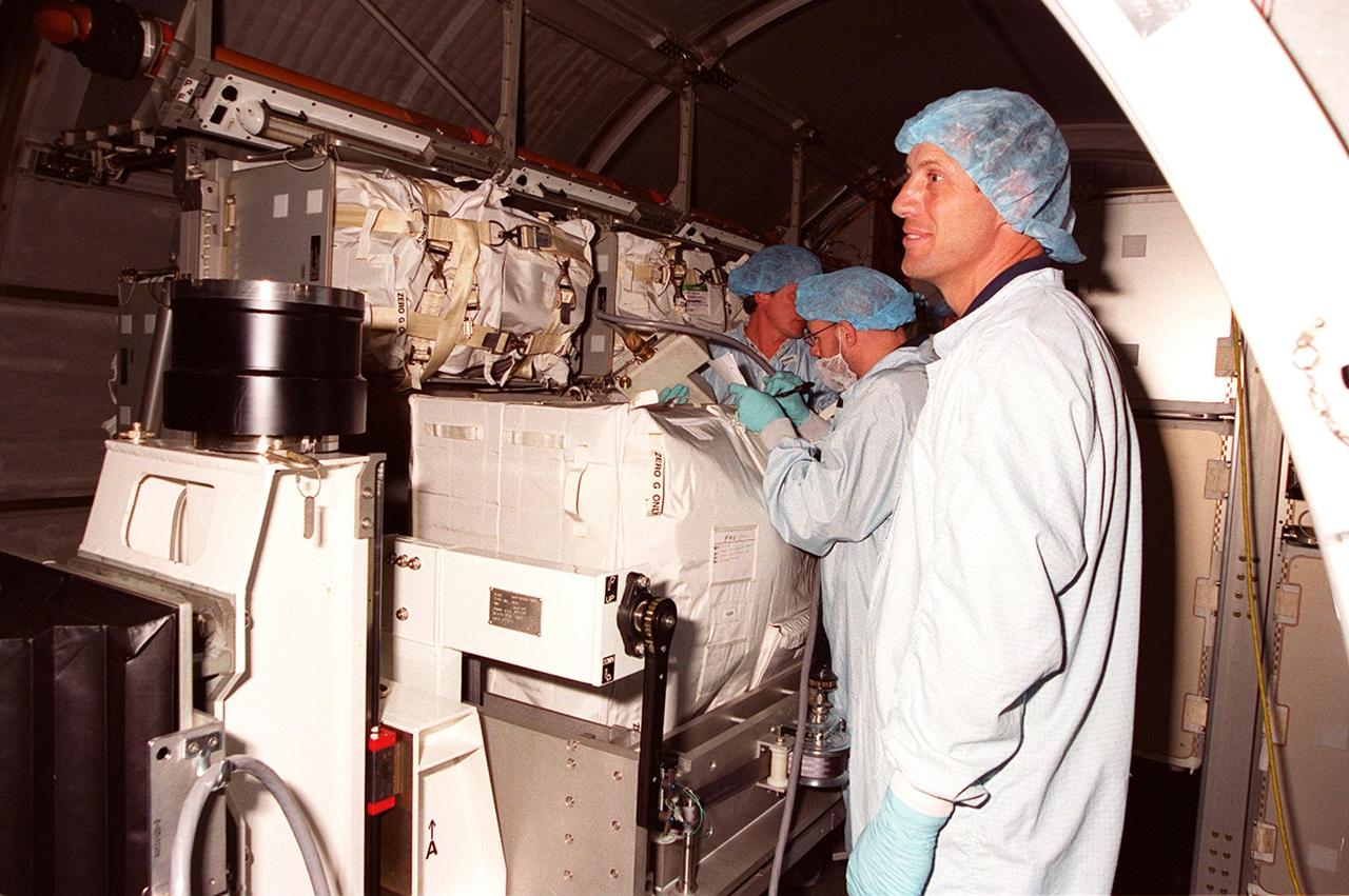 KENNEDY SPACE CENTER, FLA. -- Inside the Multi-Purpose Logistics Module Leonardo, which is in the Space Station Processing Facility, workers begin removing the containers returned from the International Space Station on mission STS-102. The MPLM brought back to KSC nearly a ton of trash and excess equipment from the Space Station. Leonardo is one of three MPLMs built by the Italian Space Agency to serve as “cargo vans” to the Station, carrying supplies and equipment. In the SSPF, Leonardo will be prepared for a future mission