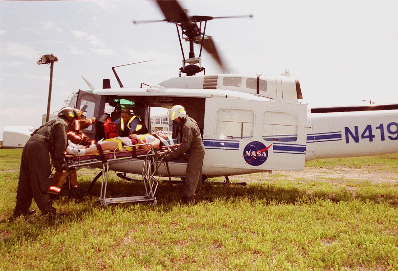 KENNEDY SPACE CENTER, FLA. -- A medevac helicopter assists with transporting “victims” during a staged mass casualty exercise in the Launch Complex 39 area. Employees are playing roles in the fictitious sniper attack that is being staged to validate capabilities of KSC’s fire, medical, helicopter transport and security personnel to respond to such an event.