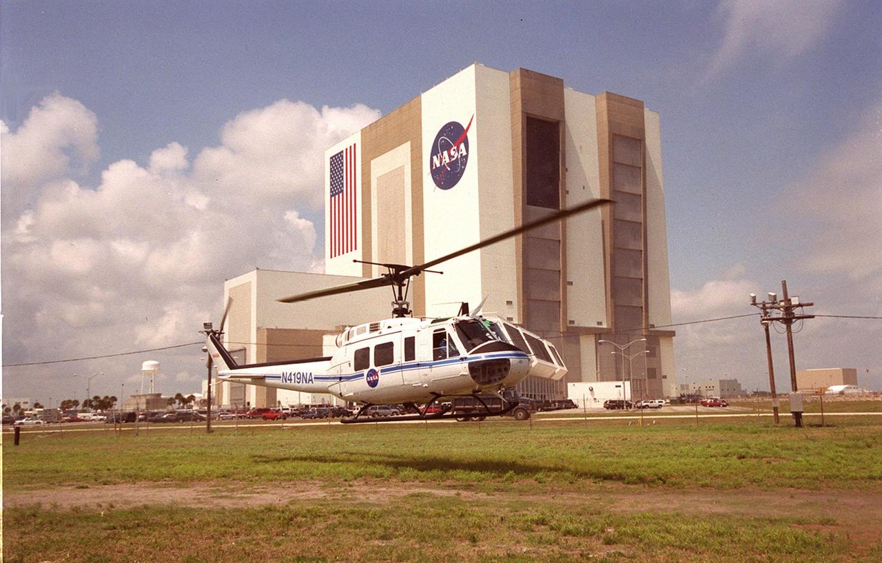 KENNEDY SPACE CENTER, FLA. -- A medevac helicopter lifts off form the site of a staged mass casualty exercise in the Launch Complex 39 area. The Vehicle Assembly Building is seen in the background. Employees are playing roles in the fictitious sniper attack that is being staged to validate capabilities of KSC’s fire, medical, helicopter transport and security personnel to respond to such an event
