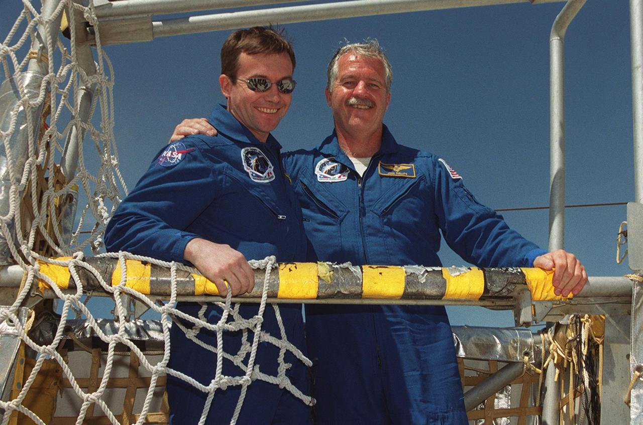 KENNEDY SPACE CENTER, FLA. -- STS-100 Mission Specialists Yuri V. Lonchakov and John L. Phillips pause during slidewire basket training on the 195-foot level of the Fixed Service Structure. They and the rest of the crew are taking part in Terminal Countdown Demonstration Test activities, which also include payload walkdown and a simulated launch countdown. The primary payload on mission STS-100 comprises the Canadian robotic arm, SSRMS, and Multi-Purpose Logistics Module, Raffaello. Launch of Space Shuttle Endeavour on mission STS-100 is targeted for April 19 at 2:41 p.m. EDT from Launch Pad 39A