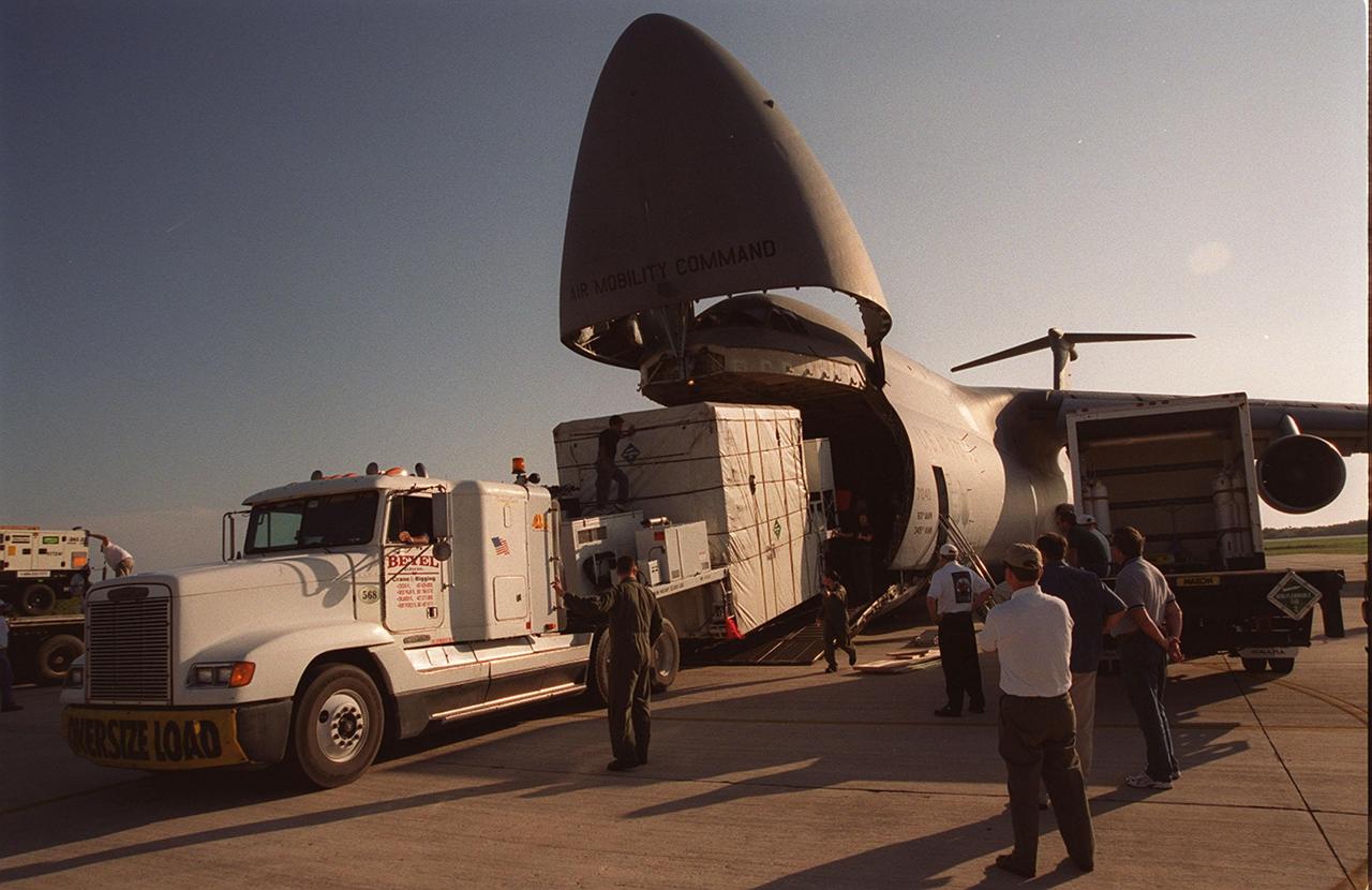  At the KSC Shuttle Landing Facility, the GOES-M satellite is offloaded from the yawning mouth of the C-5 aircraft. It will be transferred to Astrotech in Titusville, Fla., for final testing. The GOES-M (Geostationary Operational Environmental Satellite, I-M Series) provides weather imagery and quantitative sounding data used to support weather forecasting, severe storm tracking, and meteorological research. The satellite is scheduled to be launched on an Atlas-IIA booster, with a Centaur upper stage, July 12 from Launch Pad 36-A, Cape Canaveral Air Force Station