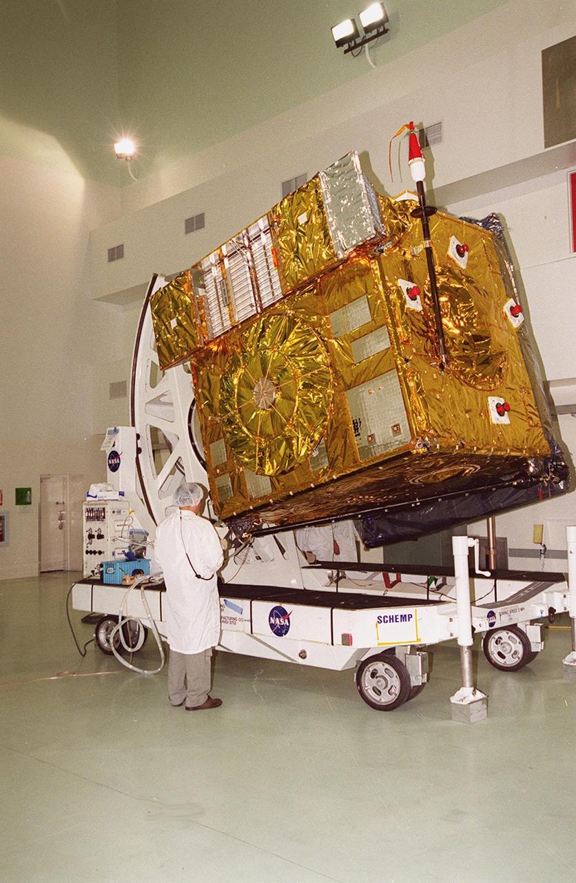 At Astrotech, Titusville, Fla., the GOES-M satellite is lifted at an angle on a workstand. The satellite is undergoing testing at Astrotech. The GOES-M provides weather imagery and quantitative sounding data used to support weather forecasting, severe storm tracking and meteorological research. The satellite is scheduled to launch July 12 on an Atlas-IIA booster, Centaur upper stage from Cape Canaveral Air Force Station