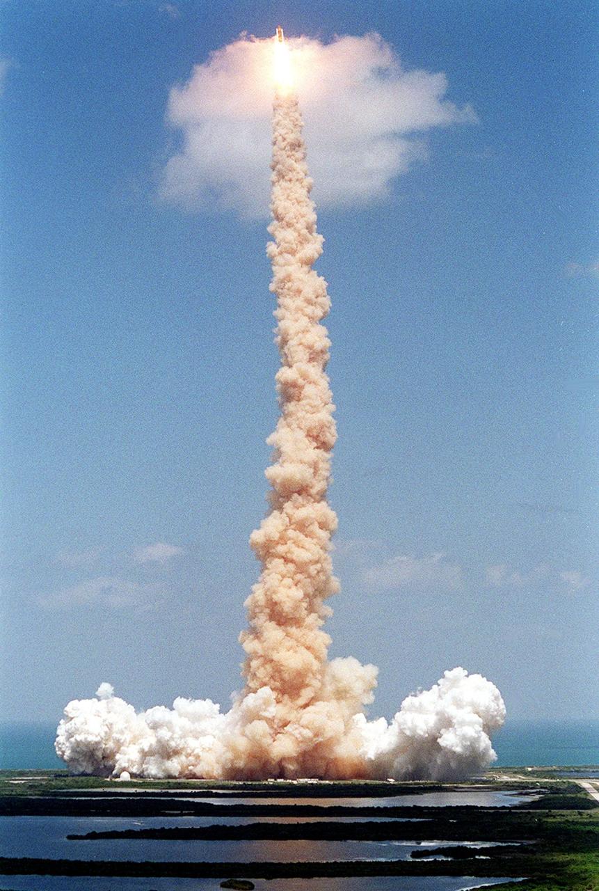 KENNEDY SPACE CENTER, FLA. -- Trailing a plume of smoke, Space Shuttle Endeavour pierces a small cloud, briefly lighting it from within, during launch on mission STS-100. Liftoff of the ninth flight to the International Space Station occurred at 2:40:42 p.m. EDT. The 11-day mission will deliver and integrate the Spacelab Logistics Pallet/Launch Deployment Assembly, which includes the Space Station Remote Manipulator System and the UHF Antenna. The mission includes two planned spacewalks for installation of the SSRMS on the Station. Also onboard is the Multi-Purpose Logistics Module Raffaello, carrying resupply stowage racks and resupply/return stowage platforms