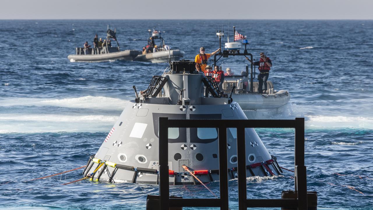NASA Recovery Team members with Exploration Ground Systems (EGS) and the U.S. Navy practice recovering a test version of the Orion capsule on Oct. 31, 2018, during Underway Recovery Test-7 (URT-7) in the Pacific Ocean. URT-7 is one in a series of tests that the EGS Recovery Team, along with the U.S. Navy, are conducting to verify and validate procedures and hardware that will be used to recover the Orion spacecraft after it splashes down in the Pacific Ocean following deep space exploration missions. Orion will have emergency abort capability, sustain the crew during space travel and provide safe re-entry from deep space return velocities.