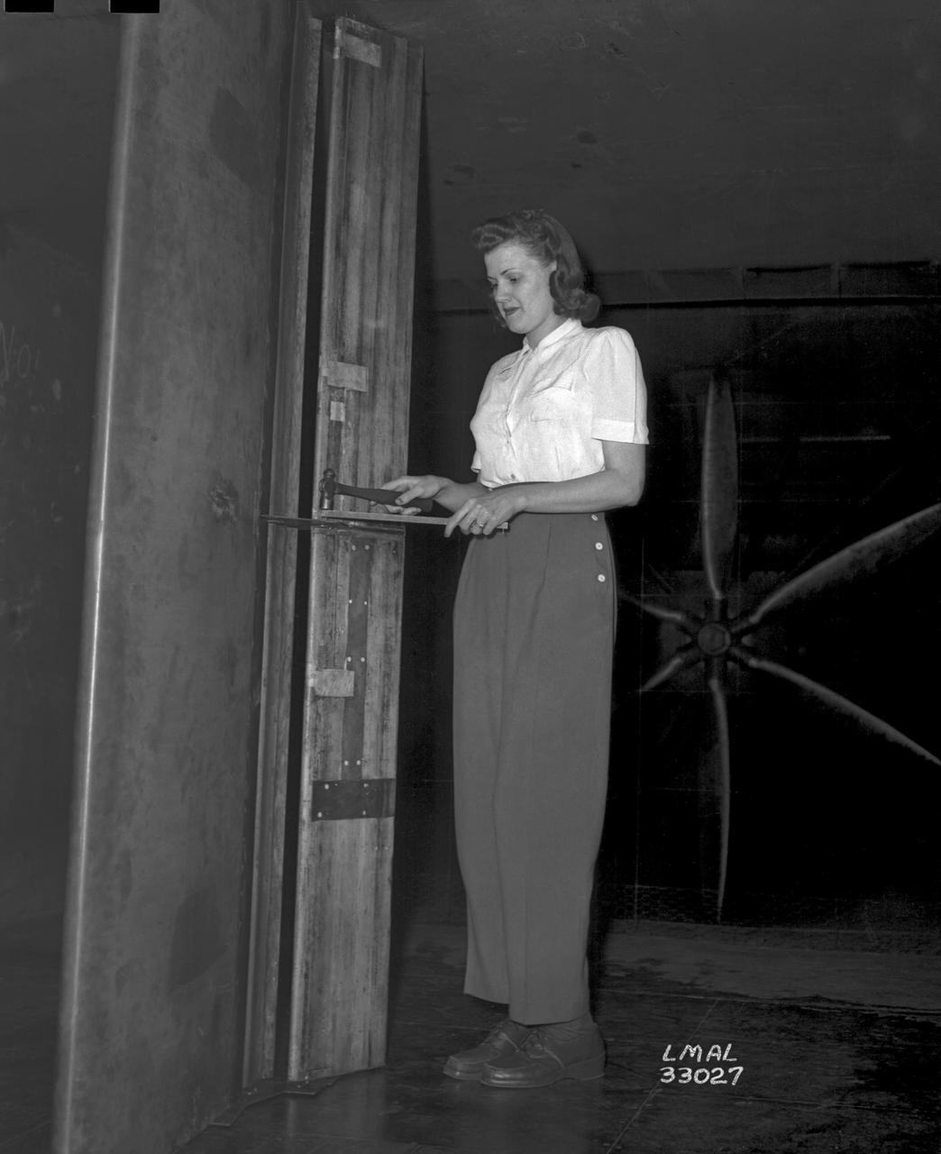 Women Adequately Filling Posts in NACA Laboratory: Nearly 200 women are employed at the Langley Laboratory of the National Advisory Committee for Aeronautics in a limited capacity as mechanics’ helpers and minor laboratory aids on the jobs formerly handled by men, according to E.H. Derring, of the Aerodynamics Division. Many phases of the operations of various wind tunnels at the laboratory are now handled by women with experienced male supervision. Mr. Derring said, pointing out that the reading of the data indicated on wind tunnel instruments during a test is done in a large measure by women.  In addition to reading the instruments and computing and integrating engineering test data obtained from tunnel investigations, the minor laboratory aides assist in the preparation of aircraft models preliminary to testing. Women employees who will serve in the Aerodynamics Division of the Laboratory attend an orientation class for two weeks, during which they receive instruction on phases of the work they will do and their aptitudes for different types of work are evaluated in order that they may be properly placed.  More than 100 women are employed in minor laboratory apprentices, performing mechanical work heretofore done by men. These women are employed in the various shops of the laboratory.  Women in the woodworking shops are taught to operate 15 different machines in carrying out their assignments. Norfolk new paper article from 1943 by Lee Dickinson.