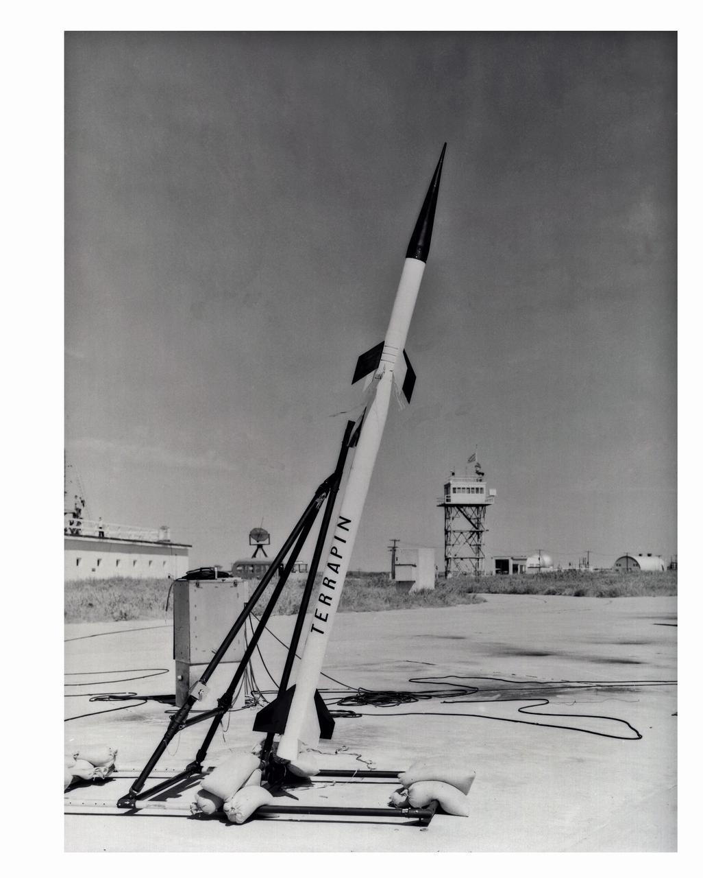 LAL 95,647 University of Maryland-Republic Terrapin sounding rocket mounted on special launcher, September 21, 1956. Photograph published in A New Dimension  Wallops Island Flight Test Range: The First Fifteen Years by Joseph Shortal. A  NASA publication. Page 506.