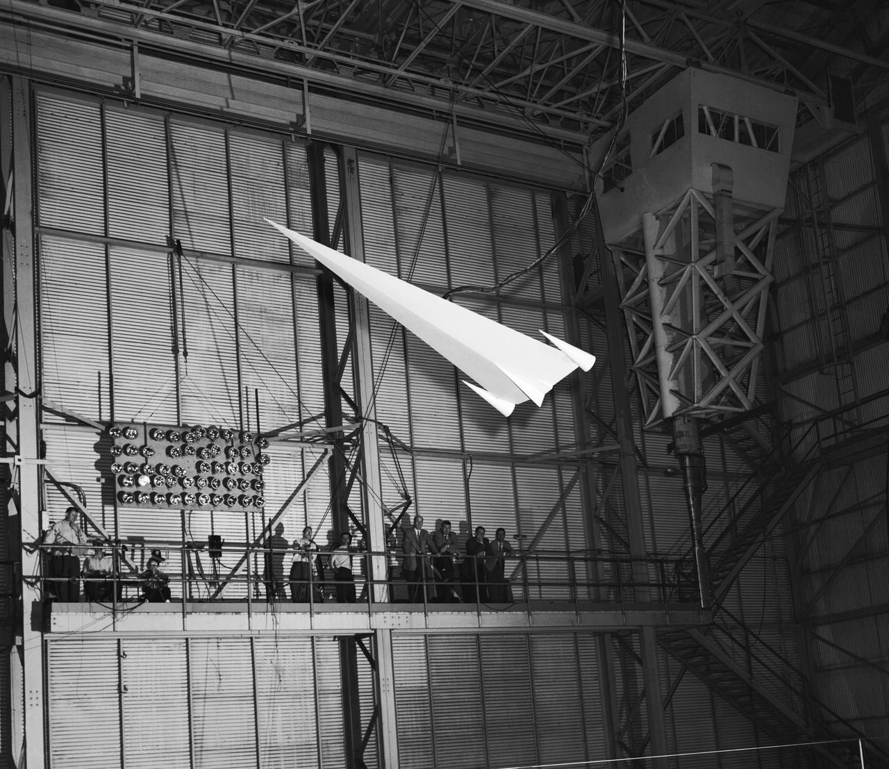 L57-1439 A model based on Langley s concept of a hypersonic glider was test flown on an umbilical cord inside the Full Scale Tunnel in 1957. Photograph published in Engineer in Charge: A History of the Langley Aeronautical Laboratory, 1917-1958 by James R. Hansen. Page 374.