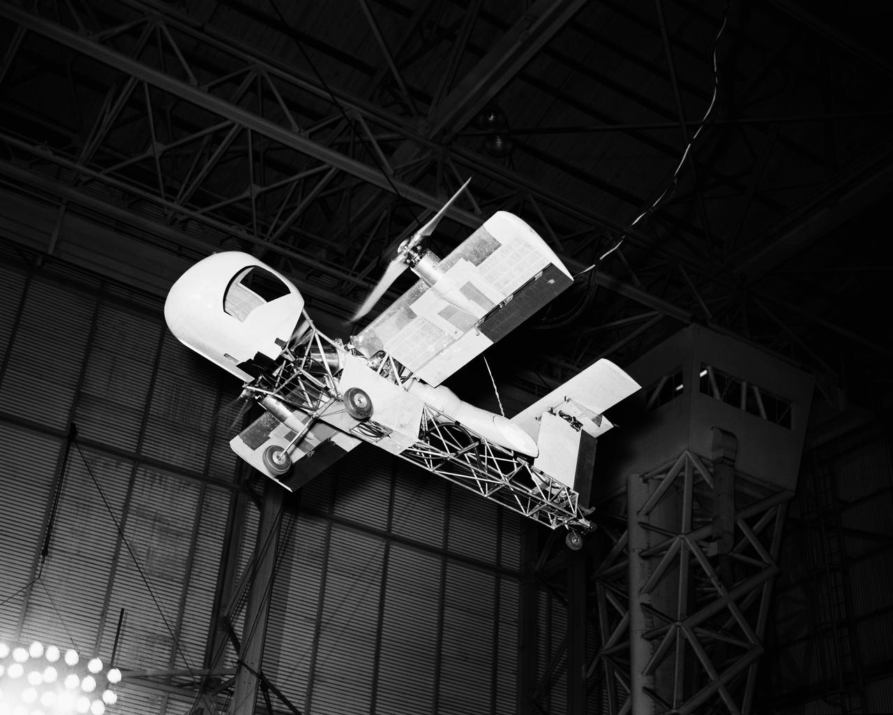 Vertical model flying in Langley Research Center's Full Scale Tunnel. 