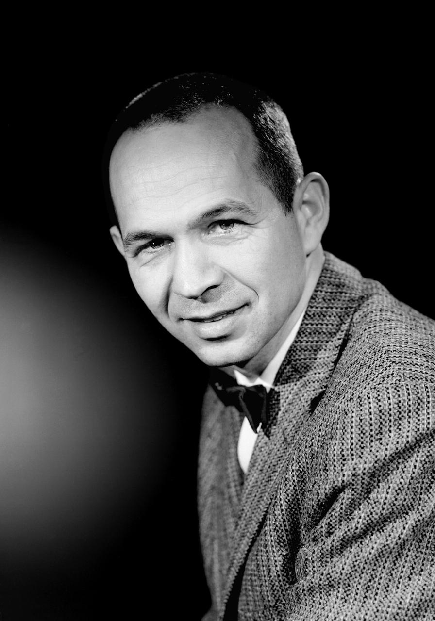 L59-1497-6 Maxime A. Faget was born in British Honduras in 1921, the son of an honored physician of the U.S. Public Health Service. In 1943 he earned a B.S. in mechanical engineering from Louisiana State University. After service as a navy submarine officer, he joined the Langley staff in 1946 as a member of the Pilotless Aircraft Research Division. His early work for PARD involved the invention of choking inlets for ramjets and a flight Mach meter. Photograph published in Engineer in Charge: A History of the Langley Aeronautical Laboratory, 1917-1958 by James R. Hansen. Page 379.