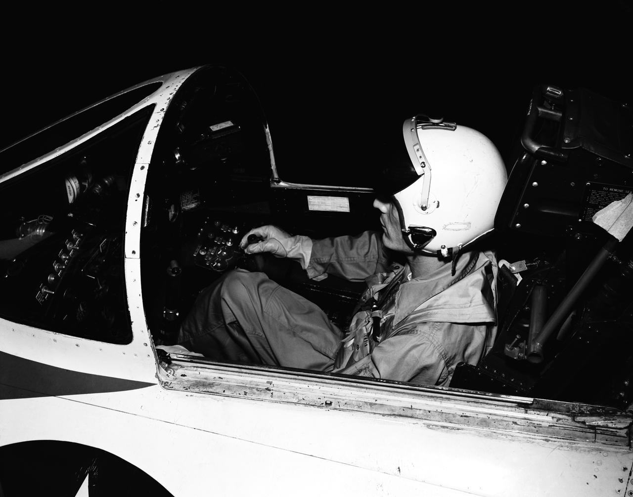 Test pilot in cockpit. 